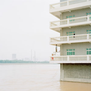 Zhang Kechun, The Yellow River No.06 – Two men painting a house in the river, Shaanxi, 2015, Inkjet print, 115 x 147 cm