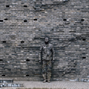 Liu Bolin, Hiding in the city N°63, Gray Opening, 2007, Archival pigment print, 150 x 118 cm