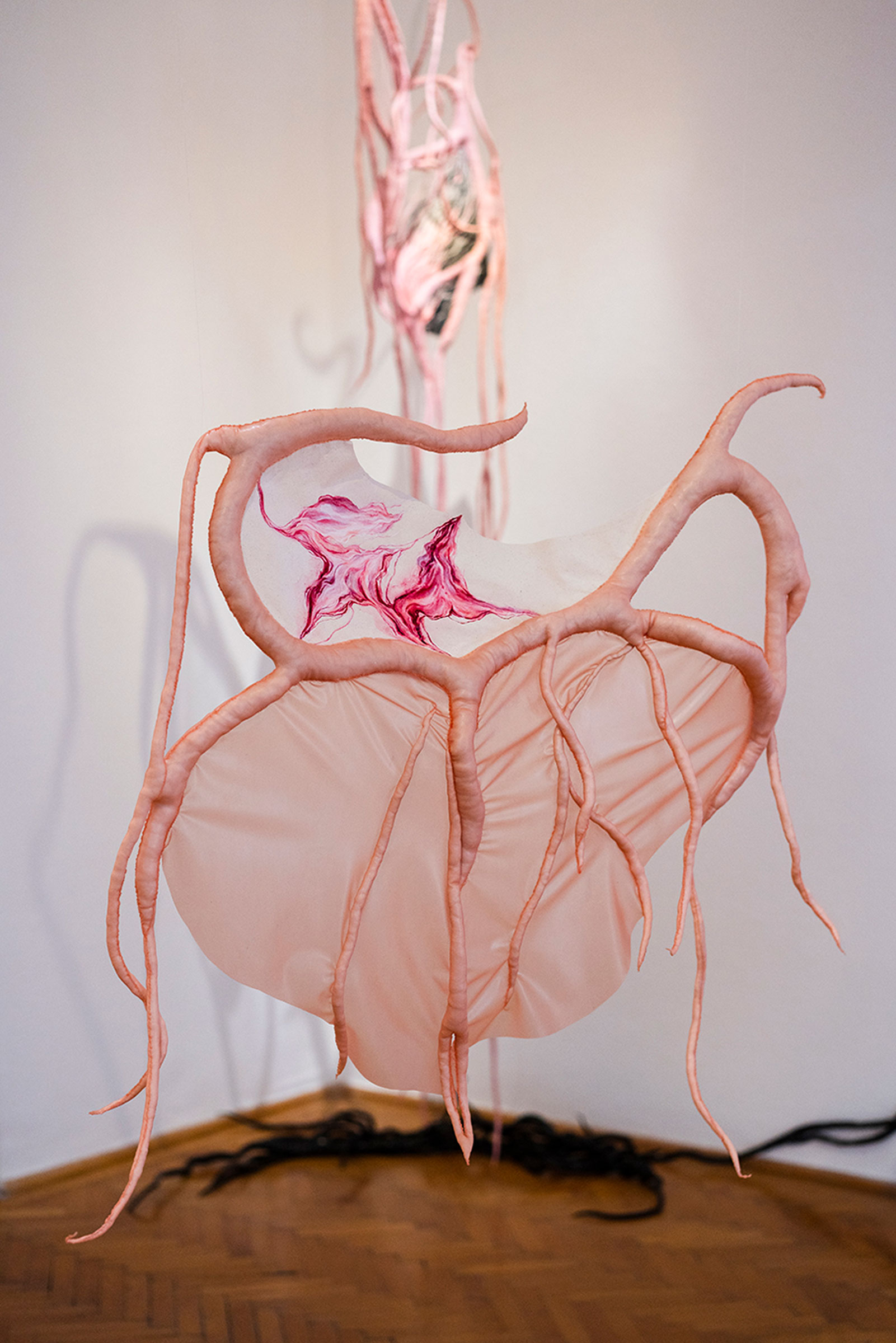 Eszter Metzing, Neonatal Skin, 2024, latex, transparent thread, pigment, varnish, canvas, wadding, 96 x 65 x 7 cm