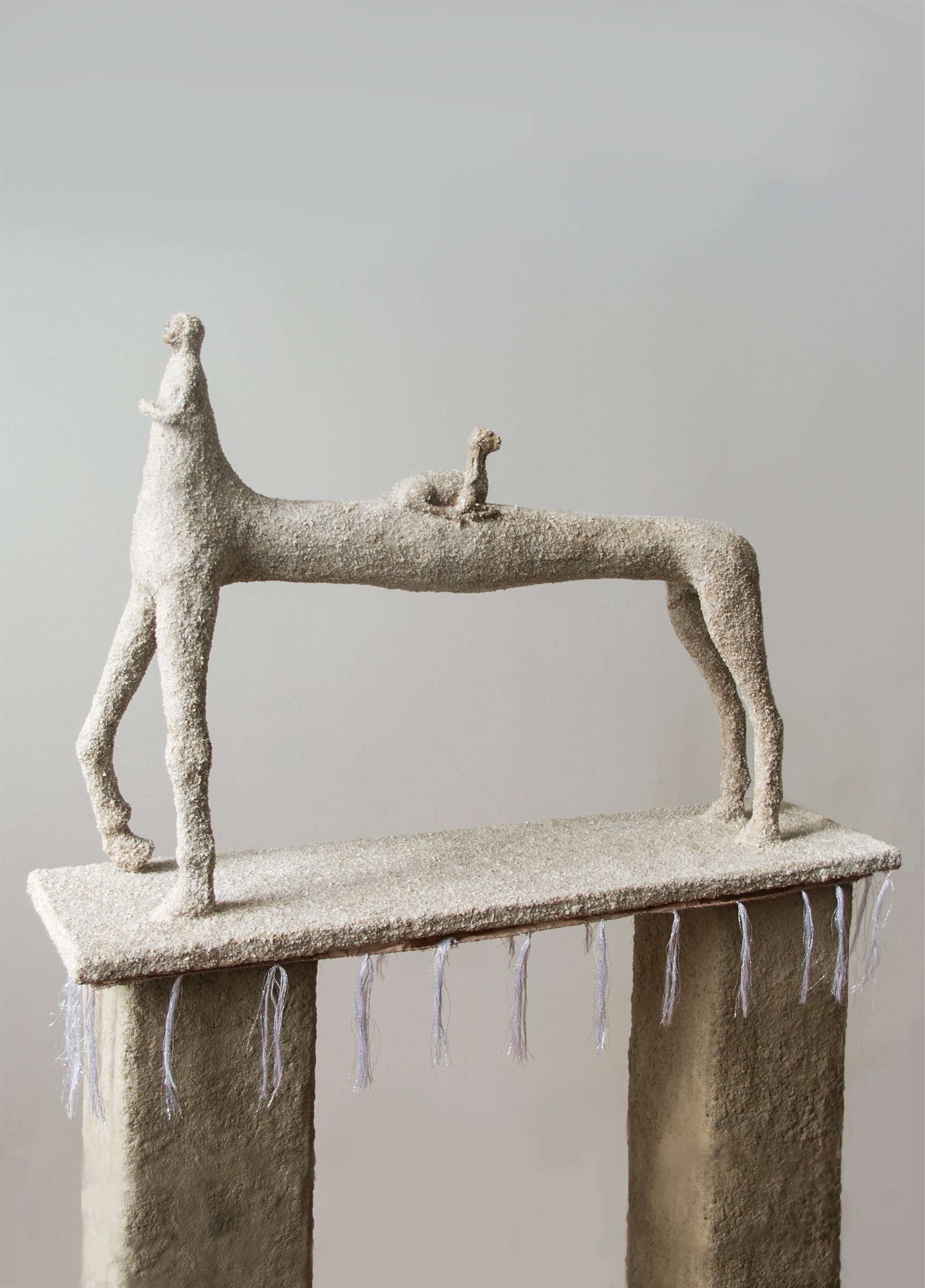 Kata Tranker, Kentaur, 2025, paper pulp, smashed stone, polyester, threads, 23 x 86 x 59 cm