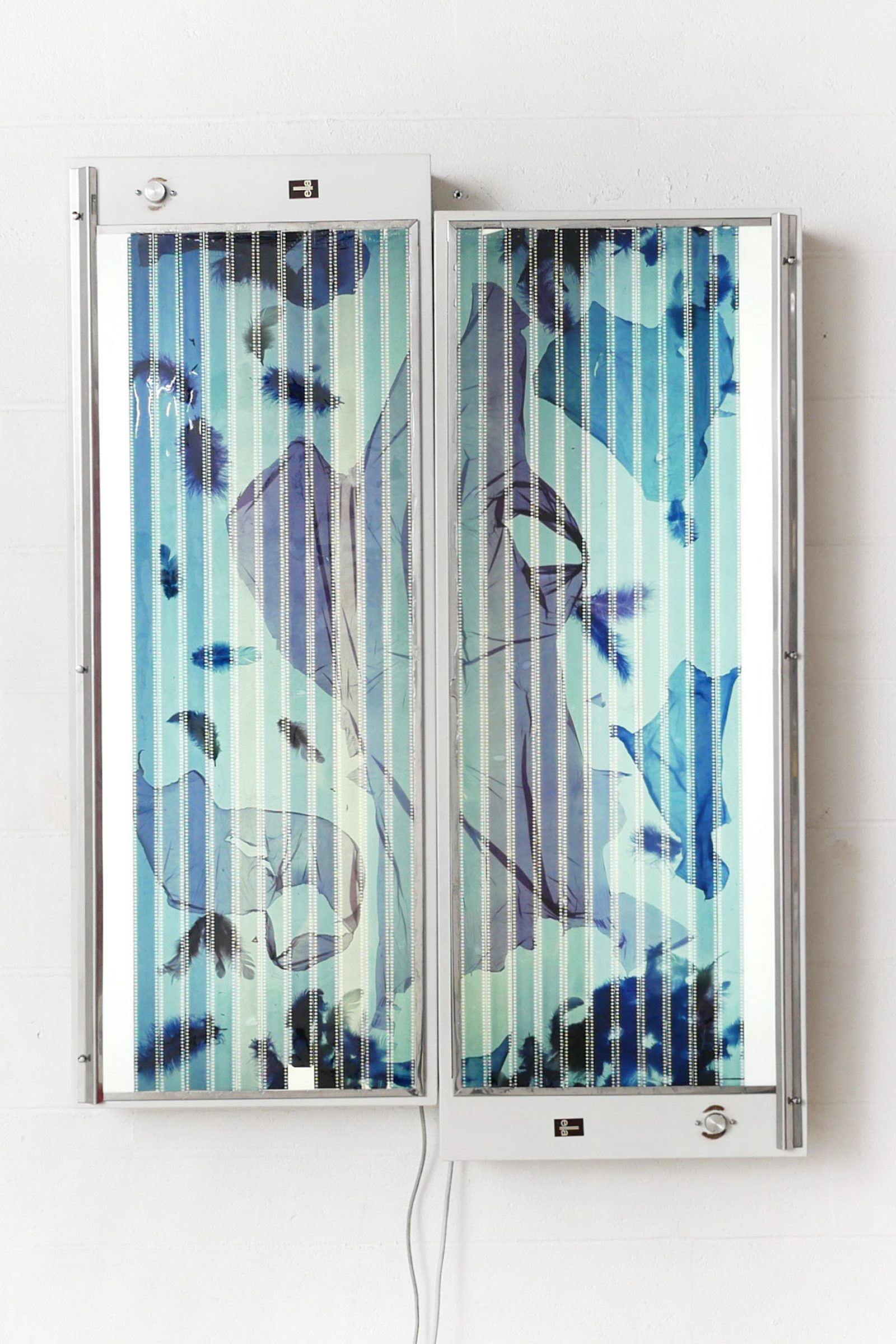 F for phantom, 2023, diptych, 35 mm reversal films, negatoscopes, epoxy resin, 138 x 100 x 15 cm